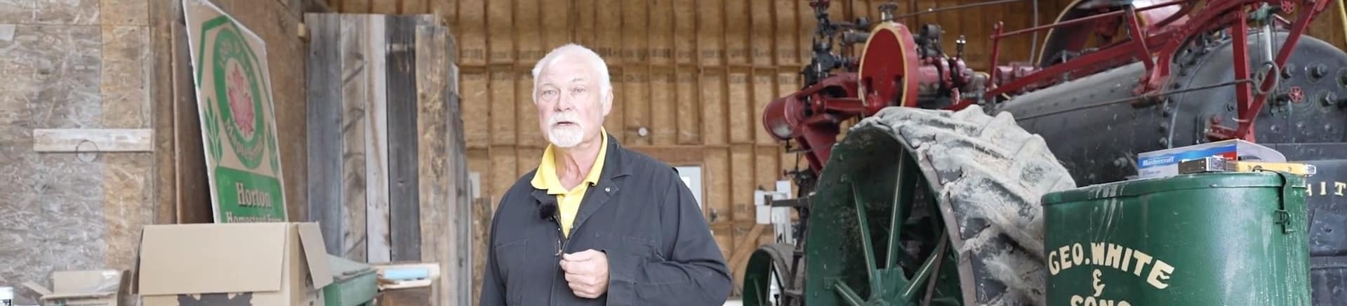 Man in Sugar Barn explaining how to make Maple Syrup